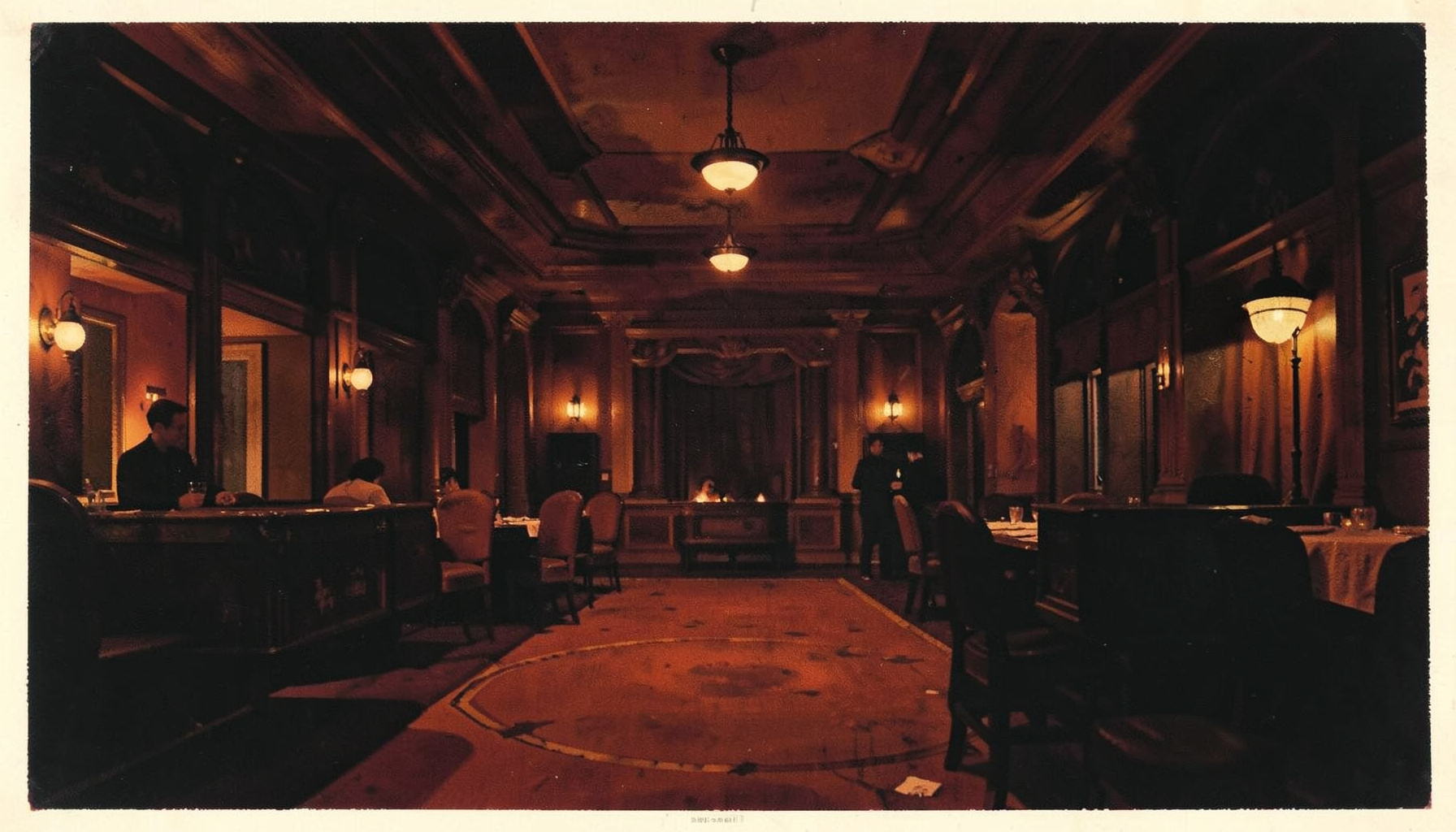 Matte gouache poster painting of a dark casino floor with warm amber lighting, deep red and black tones, atmospheric and moody